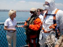 German Defence Minister Ursula von der Leyen (L) talks to soldiers during a drill for a search and rescue operation aboard the German navy vessel Schleswig Holstein near the harbour of the Sicilian port city of Catania, Italy, July 4, 2015. PHOTO BY REUTERS/Fabrizio Bensch