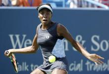 Venus Williams returns a shot from Lucie Safarova on day two of the Western and Southern Open tennis tournament at Linder Family Tennis Center