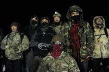Veterans have a demonstration on Backwater bridge during a protest against plans to pass the Dakota Access pipeline near the Standing Rock Indian Reservation, near Cannon Ball, North Dakota, U.S., December 1, 2016. PHOTO BY REUTERS/Stephanie Keith
