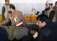 Rescue workers move a man who sustained injuries in a suicide attack at a government office, to Lady Reading Hospital in Peshawar, Pakistan, December 29, 2015. PHOTO BY REUTERS/Khuram Parvez