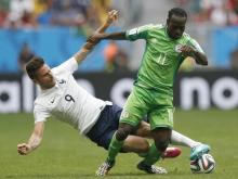 France's Olivier Giroud (L) fights for the ball with Nigeria's Victor Moses during their 2014 World Cup round of 16 game at the Brasilia national stadium in Brasilia, June 30, 2014. PHOTO BY REUTERS/Ueslei Marcelino