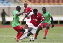 Kenya's Victor Wanyama (C) dribbles against Malawi's Frank Banda (L) and James Sangala (R) during their African qualifier soccer match for the 2014 World Cup in Brazil, in Nairobi