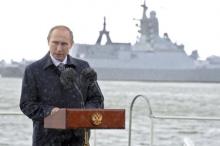 Russian President Vladimir Putin delivers a speech during celebrations for Navy Day as it rains in Baltiysk, Kaliningrad region, Russia, July 26, 2015. PHOTO BYREUTERS/Mikhail Klimentyev