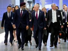 U.S. Secretary of Defence Jim Mattis and Canada's Defence Minister Harjit Sajjan arrive to attend a NATO defence ministers meeting at the Alliance headquarters in Brussels, Belgium, June 7, 2018. PHOTO BY REUTERS/Virginia Mayo/Pool