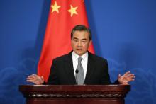 Chinese Foreign Minister Wang Yi attends a news conference after the 13th Russia-India-China Foreign Ministers' Meeting, at Diaoyutai State Guesthouse in Beijing, February 2, 2015. PHOTO BY REUTERS/Wu Hong