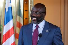 Liberia's President George Weah laughs during a news conference at Presidential palace in Abidjan, Ivory Coast, April 4, 2018. PHOTO BY REUTERS/Thierry Gouegnon