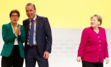 Manfred Weber of the Bavarian sister party CSU (Christian Social Union) appears on stage with newly elected CDU leader Annegret Kramp-Karrenbauer and German Chancellor and former leader of the party Angela Merkel, during the Christian Democratic Union (CDU) party congress in Hamburg, Germany, December 8, 2018. PHOTO BY REUTERS/Kai Pfaffenba