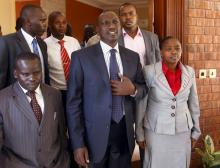 Former Kenyan cabinet minister William Ruto (C) stands next to his wife Rachel (R) and Kenyan radio presenter Joshua Arap Sang (L) in Ruto's house after hearing the news from the International Criminal Court in Nairobi, January 23, 2012. PHOTO BY REUTERS/Goran Tomasevic