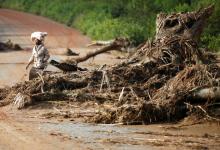 A woman walks past debris caused by Cyclone Idai near a damaged bridge in Chimanimani, Zimbabwe, March 24, 2019. PHOTO BY REUTERS/Philimon Bulawayo