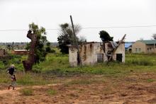 A woman walks toward a house damaged by Boko Haram militants, along the Konduga-Bama road in Bama, Borno, Nigeria, August 31, 2016. PHOTO BY REUTERS/Afolabi Sotunde