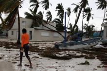 A woman walks among debris on the seashore in the aftermath of Hurricane Maria in Punta Cana, Dominican Republic, September 21, 2017. PHOTO BY REUTERS/Ricardo Rojas