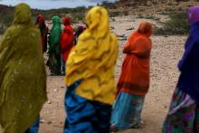 Women look on as men show aid workers the carcasses of livestock that died due to drought close to the town of Borama, Somaliland, April 17, 2016. PHOTO BY REUTERS/Siegfried Modola