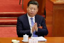 China's President Xi Jinping claps during the opening session of the National People's Congress (NPC) at the Great Hall of the People in Beijing, China, March 5, 2017. PHOTO BY REUTERS/Jason Lee