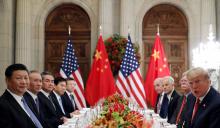 U.S. President Donald Trump, U.S. Secretary of State Mike Pompeo, U.S. President Donald Trump's national security adviser John Bolton and Chinese President Xi Jinping attend a working dinner after the G20 leaders summit in Buenos Aires, Argentina, December 1, 2018. PHOTO BY REUTERS/Kevin Lamarque