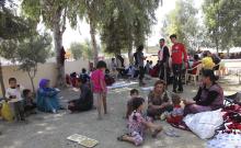 Displaced people from the minority Yazidi sect, fleeing the violence in the Iraqi town of Sinjar west of Mosul, take refuge at Dohuk province
