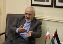 MOSCOW (Reuters) - Iran wants to take part in next week's international peace conference on Syria but will not attend if conditions are set for its participation, Foreign Minister Mohammad Javad Zarif said on Thursday.  The United States says Iranian delegates should be at the conference in Montreux, Switzerland, only if they are willing to accept an agreement reached at a June 2012 peace conference in Geneva calling for a transitional government body to be established in Damascus "by mutual consent".  Wash