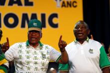 South Africa's President Jacob Zuma sings next to newly elected president of the ANC Cyril Ramaphosa. PHOTO BY REUTERS/Siphiwe Sibeko