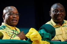 Former leader of South Africa Jacob Zuma sits next to President Cyril Ramaphosa at the 54th National Conference of the ruling African National Congress (ANC) at the Nasrec Expo Centre in Johannesburg, South Africa, December 16, 2017. PHOTO BY REUTERS/Siphiwe Sibeko